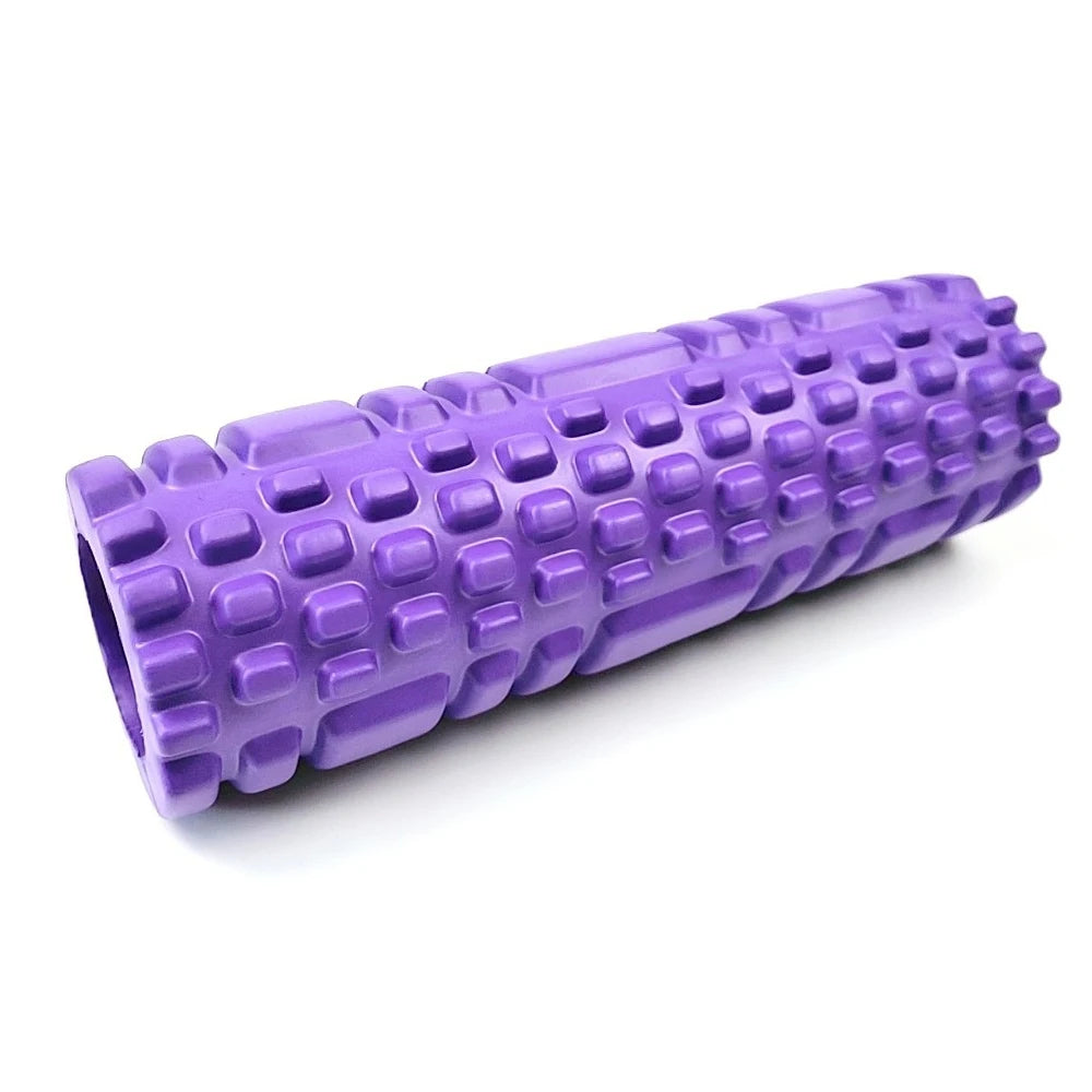Purple foam roller with textured surface on a white background