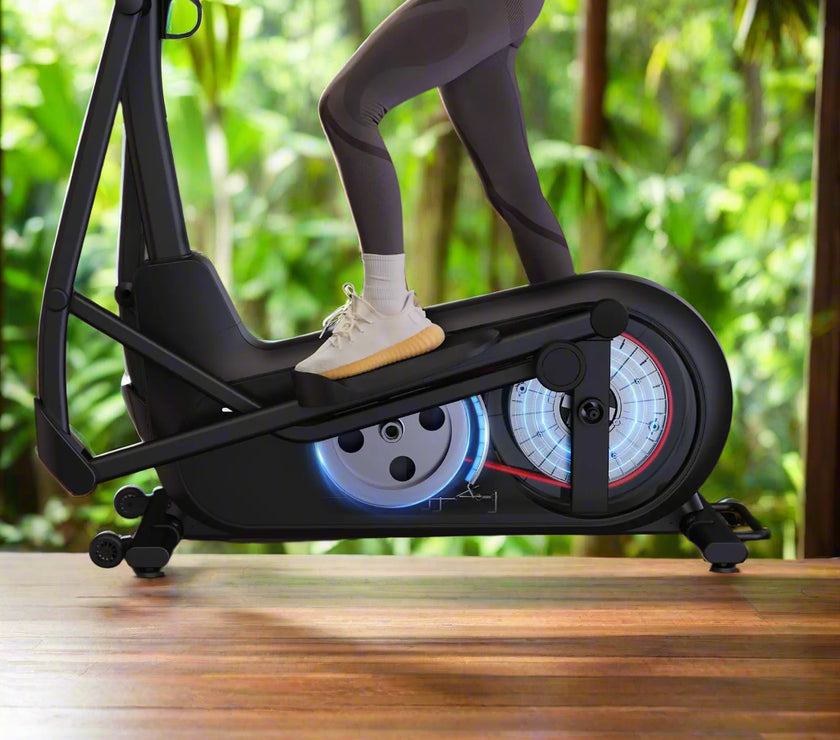 Woman using elliptical machine