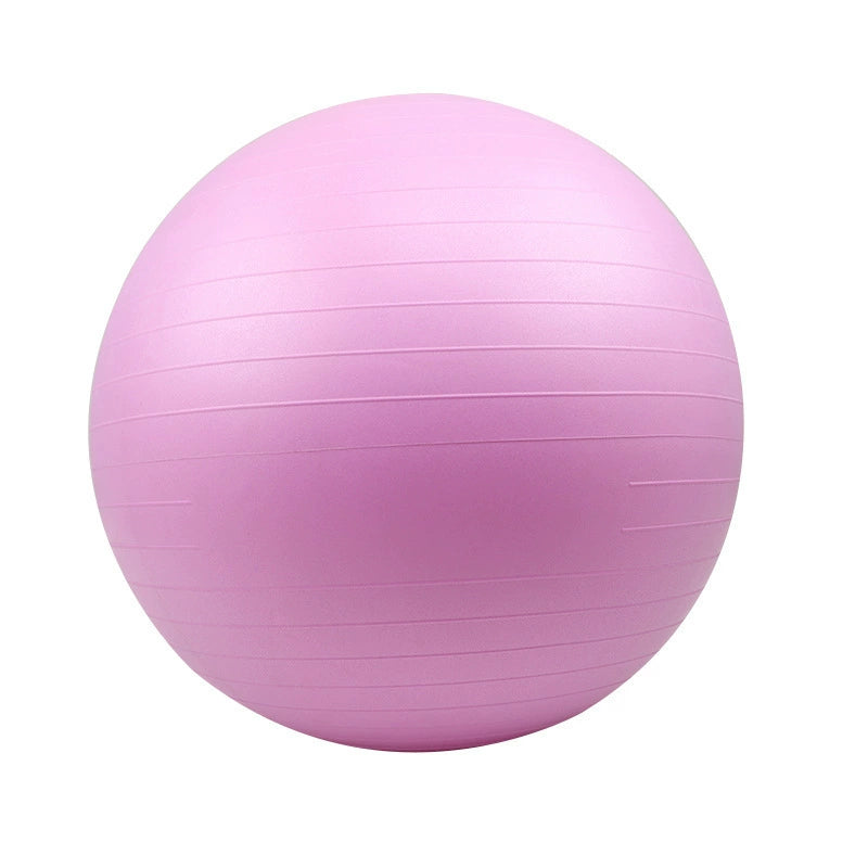 Pink exercise ball on a white background