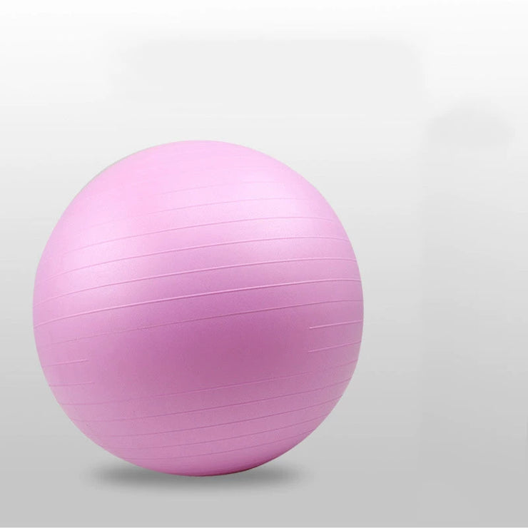 Pink exercise ball on a light gray background