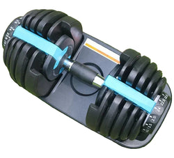 Pair of adjustable dumbbells on a grassy background