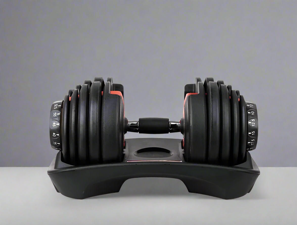 Pair of adjustable dumbbells on a white background with a red banner at the top.