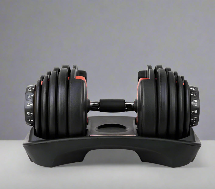 Pair of adjustable dumbbells on a white background with a red banner at the top.
