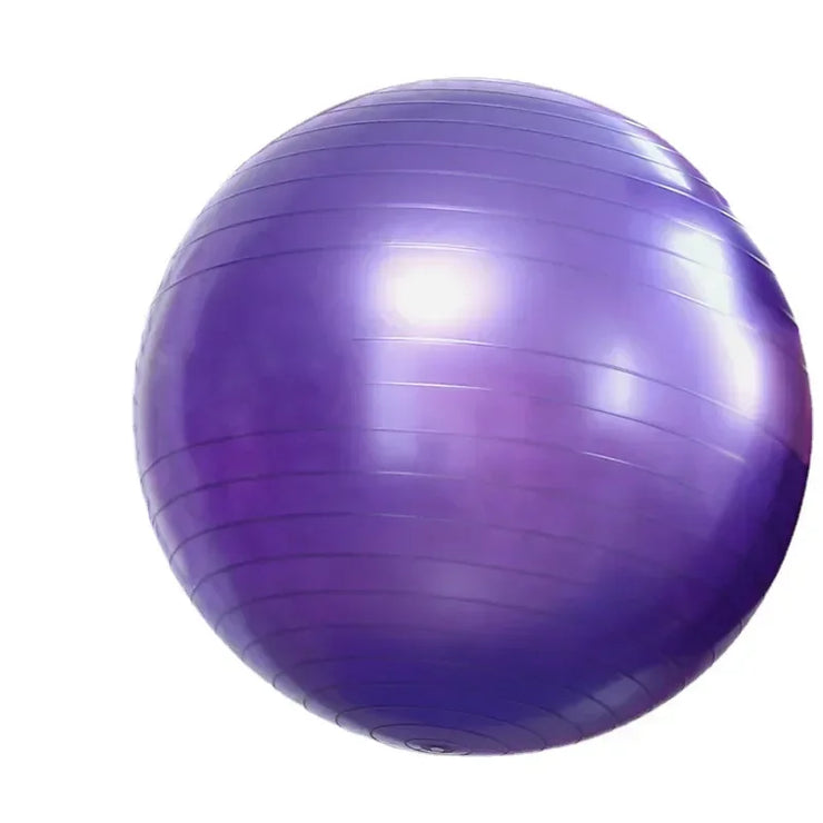 Purple exercise ball on a white background