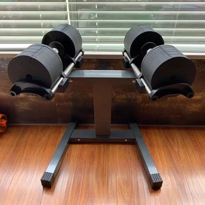 Pair of weight machines on a wooden floor with a window in the background