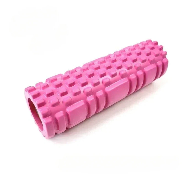 A set of four yoga rollers in black, blue, pink, and purple colors, each featuring a textured surface for muscle activation.