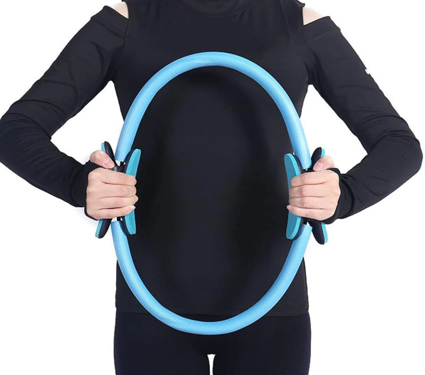 Person wearing a black outfit holding a blue exercise hoop against a white background