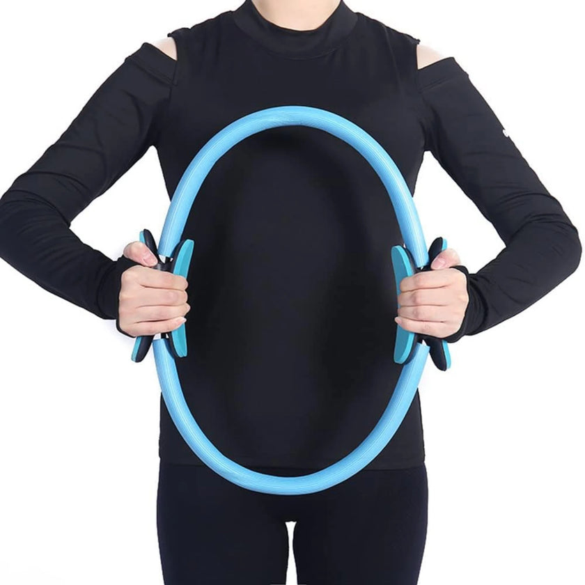 Person wearing a black outfit holding a blue exercise hoop against a white background