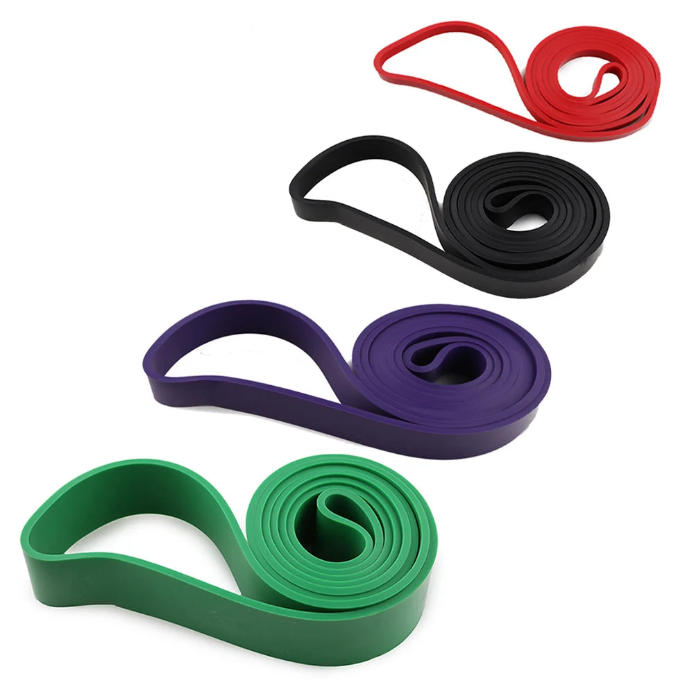 Set of resistance bands in red, black, purple, and green on a white background