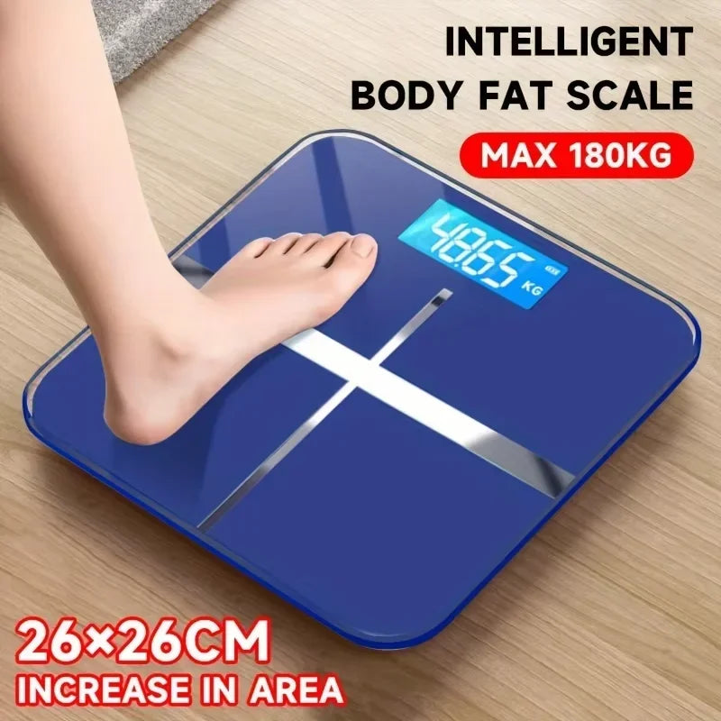 Blue digital body fat scale with a foot on it, displaying weight, on a wooden floor.