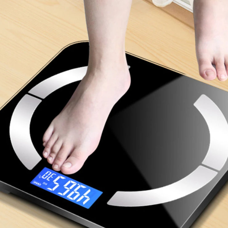 Person stepping on a digital bathroom scale displaying weight.