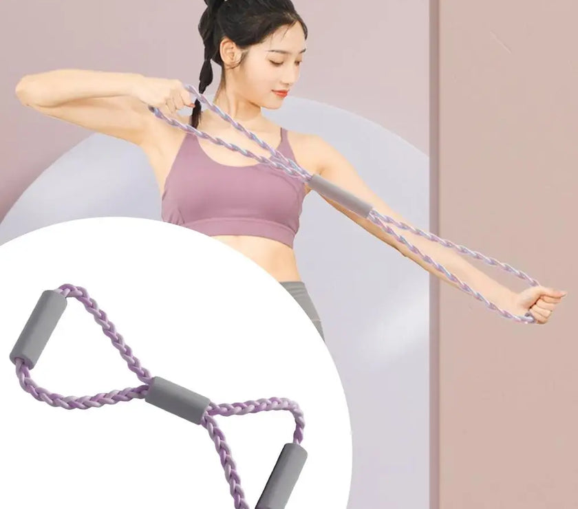 Woman exercising with a resistance band against a plain background