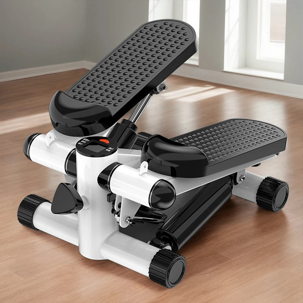 White and black step machine on a wooden floor with a window in the background