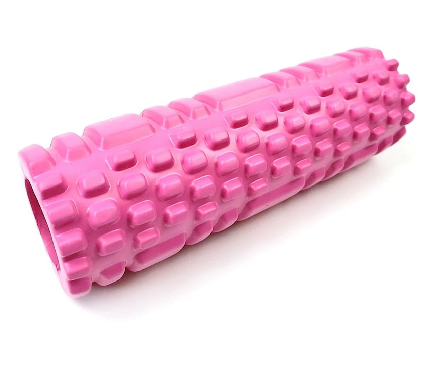 Pink foam roller on a white background
