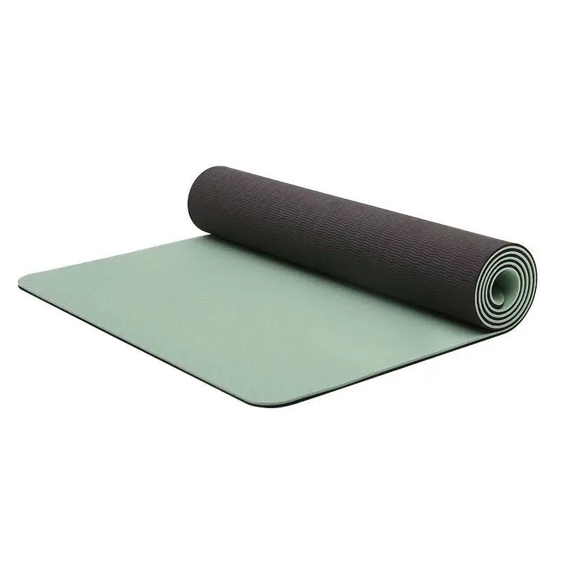 Two yoga mats, one green and one brown, on a white background