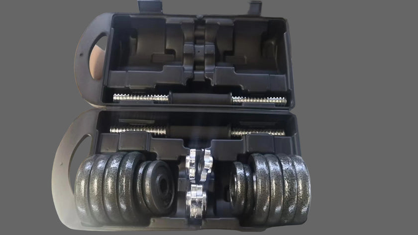 Dumbbell set with weights in a carrying case on a metal surface.