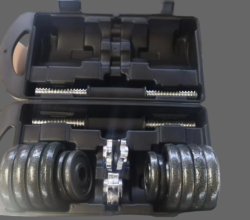 Dumbbell set with weights in a carrying case on a metal surface.
