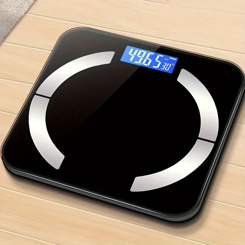 Digital body fat scale on a wooden floor