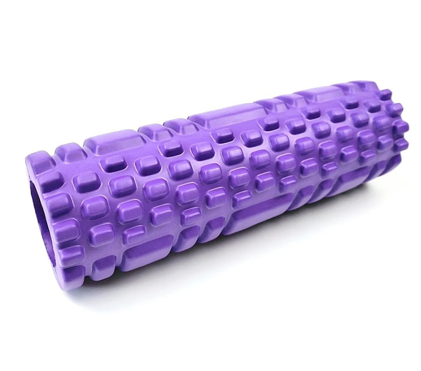 Purple foam roller with textured surface on a white background