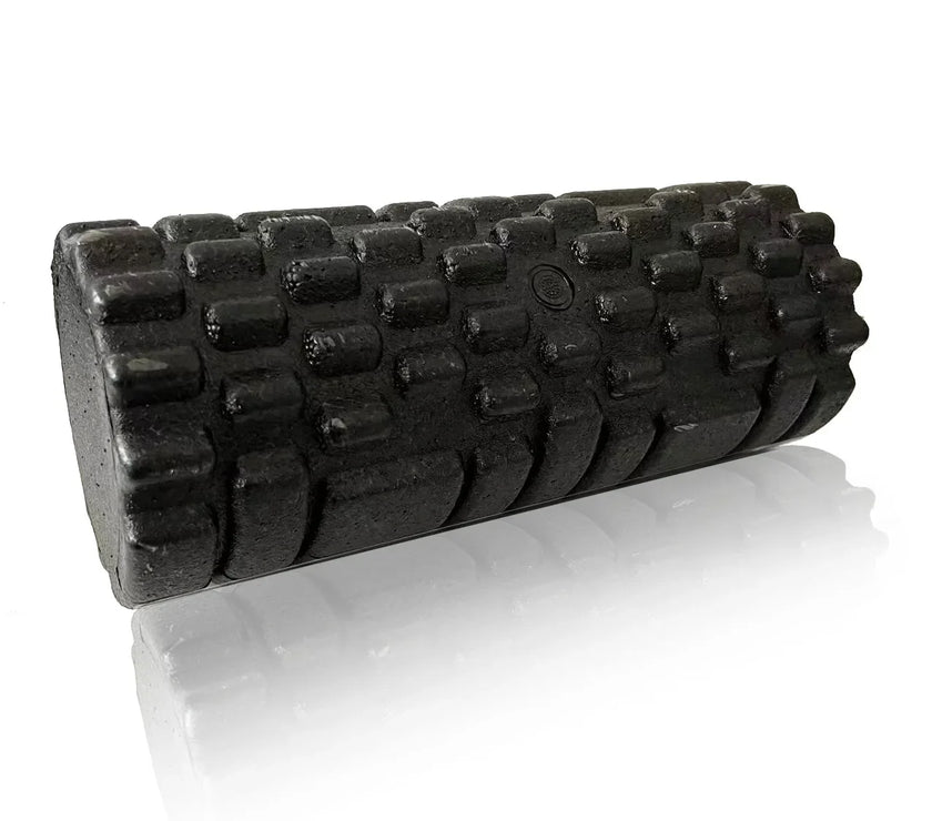 Black foam roller with textured surface on a white background