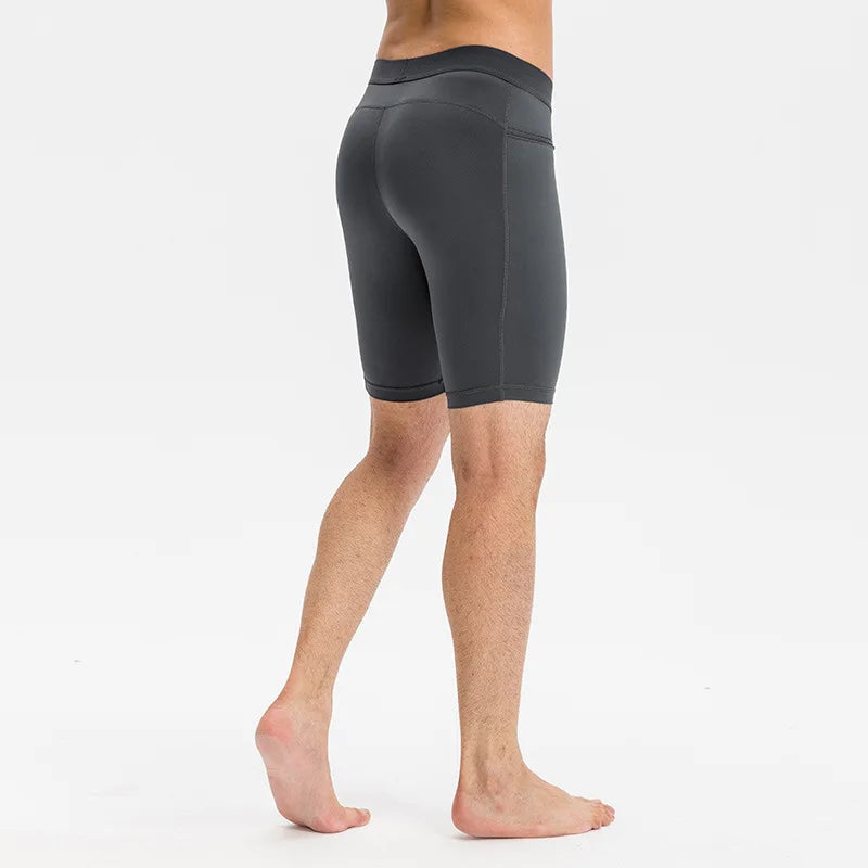 Men’s black quick-dry compression tights, designed for athletic performance and muscle support