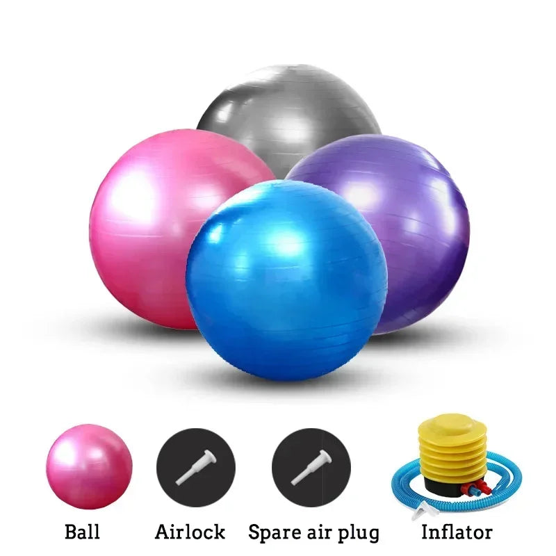 Set of colorful exercise balls with accessories on a white background