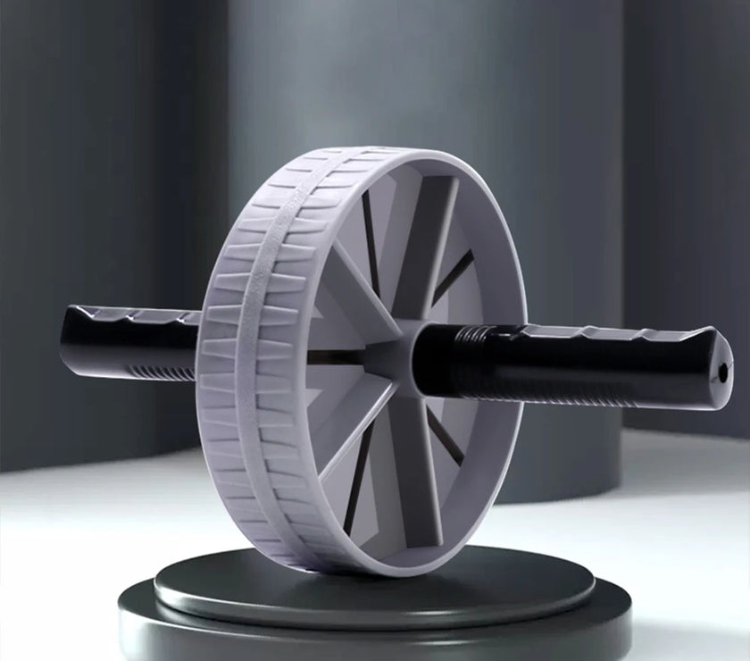 Gray ab roller on a white surface with a dark background