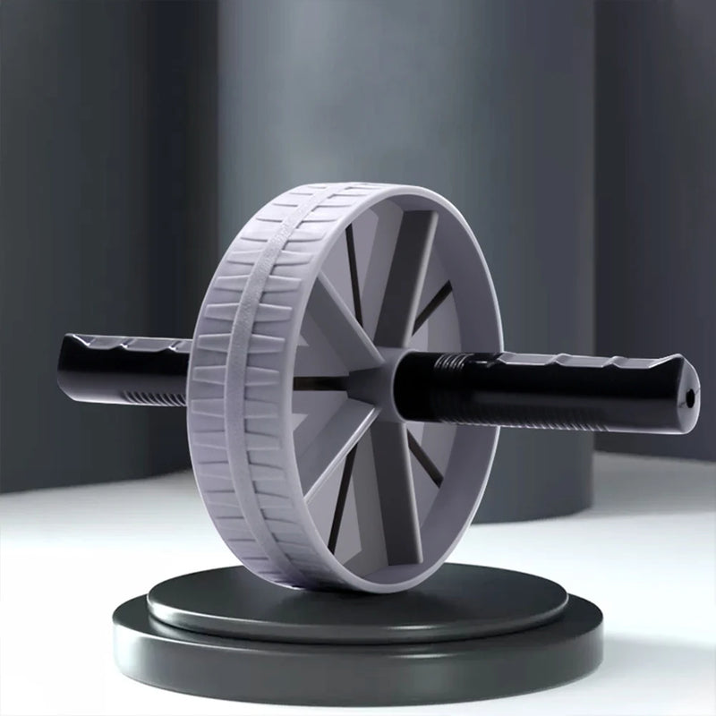 Gray ab roller on a white surface with a dark background