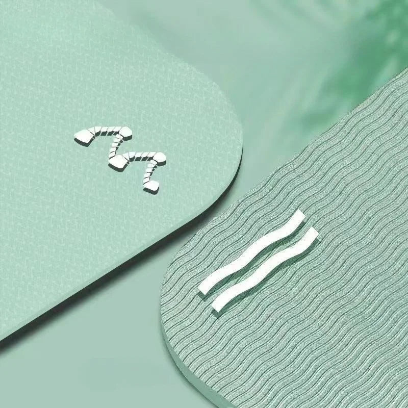 Two white abstract designs on a textured green surface