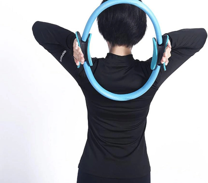 Person using a blue exercise hoop against a white background