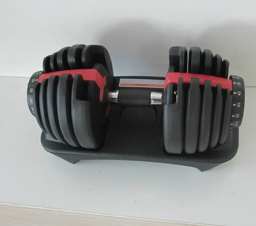 Adjustable dumbbell on a white surface