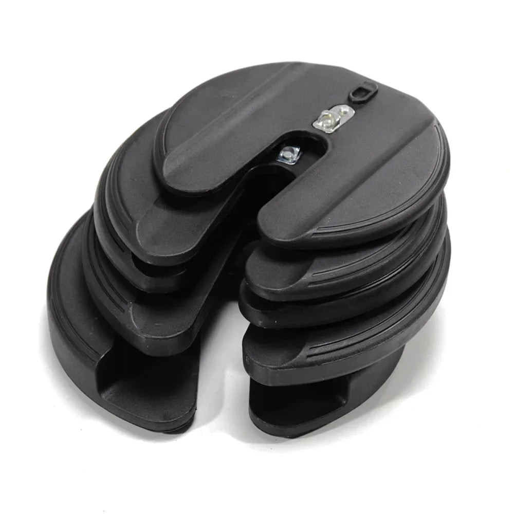 Stack of black plastic components on a white background