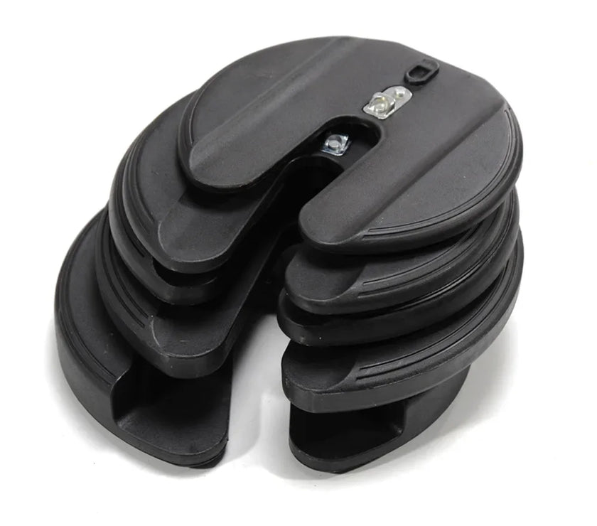 Stack of black plastic components on a white background