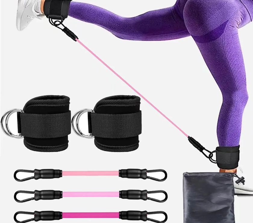 An image showing a person using an ankle cuff with a resistance band, which is pink in color. The set includes additional bands and a black carrying case.