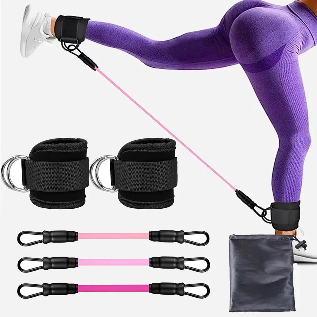 An image showing a person using an ankle cuff with a resistance band, which is pink in color. The set includes additional bands and a black carrying case.