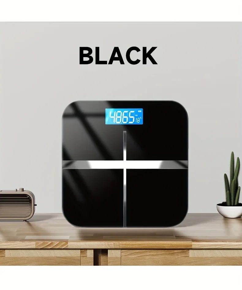 Black digital scale on a wooden surface with 'BLACK' text above it.