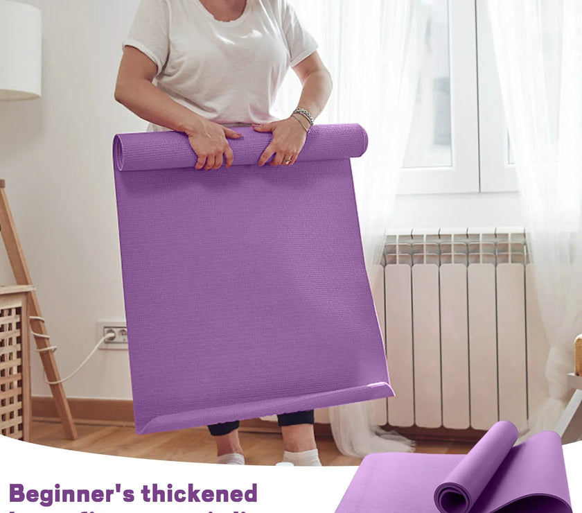 Person holding a purple thickened home fitness anti-slip mat in a room.