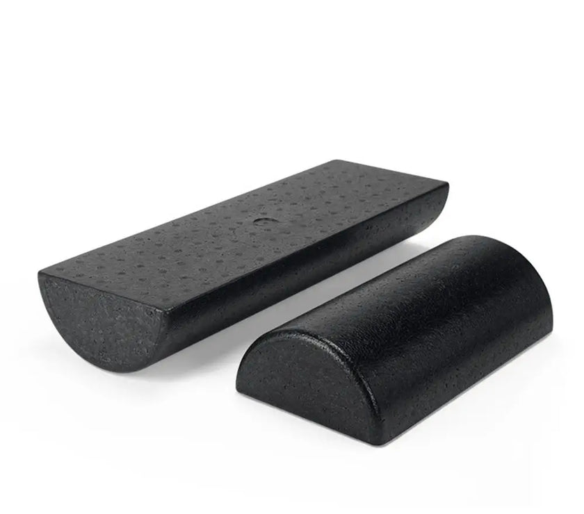 Two black wedge-shaped objects on a white background