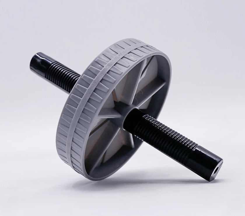 Gray and black ab roller on a light gray background