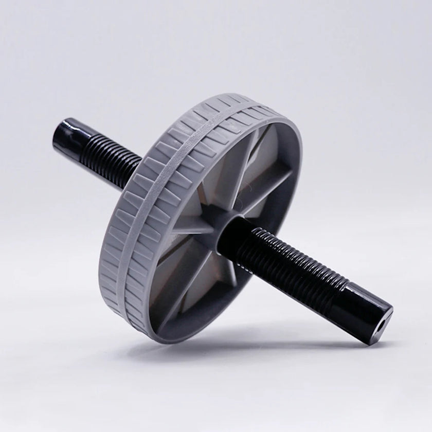 Gray and black ab roller on a light gray background
