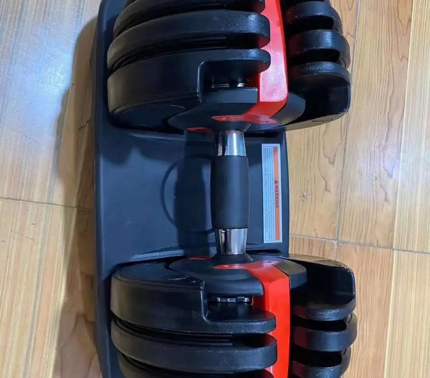 Adjustable dumbbell on a wooden floor