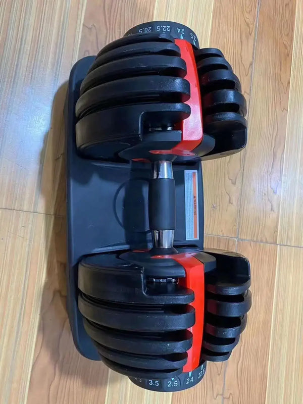 Adjustable dumbbell on a wooden floor