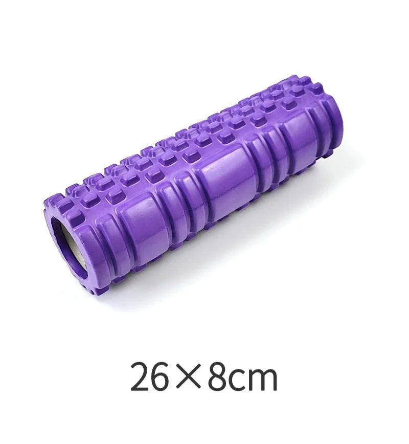 Purple foam roller with textured surface on a white background