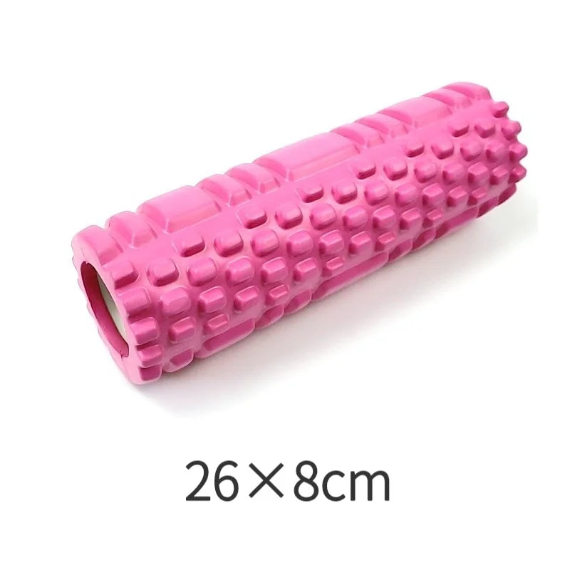 Pink foam roller with textured surface on a white background