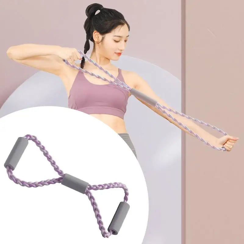 Woman exercising with a resistance band against a plain background