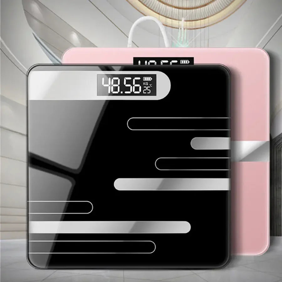 Digital bathroom scale with black and pink design on a light gray floor.