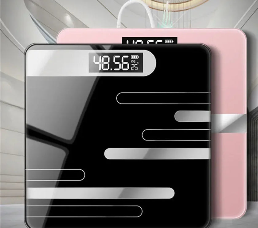 Digital bathroom scale with black and pink design on a light gray floor.