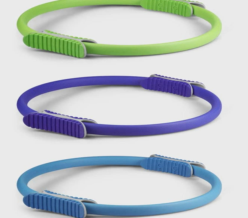 Three colorful dog leashes in green, purple, and blue on a white background