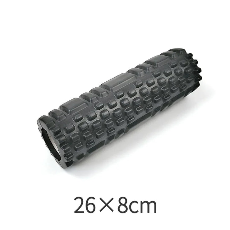Black foam roller with textured surface on a white background