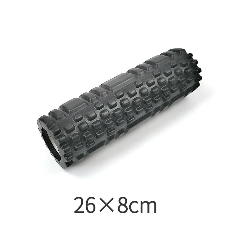 Black foam roller with textured surface on a white background